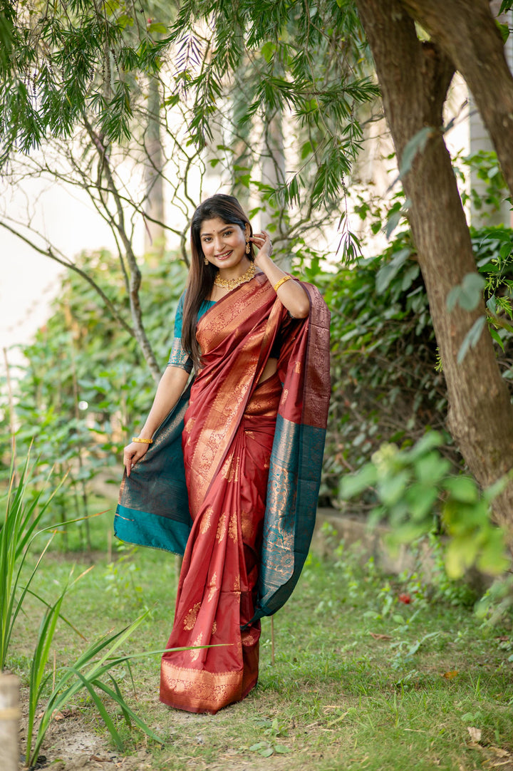 Latest Red Indian Sadi in soft Banarasi Katan silk, with delicate zari work and a matching blouse piece for a complete look.