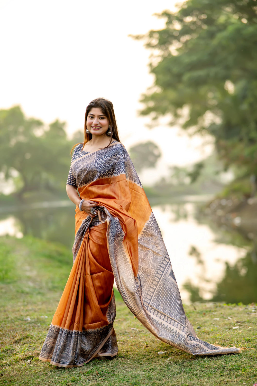 Stunning deep yellow soft tussar silk saree featuring intricate Madhubani prints and elegant tassels, ideal for weddings.