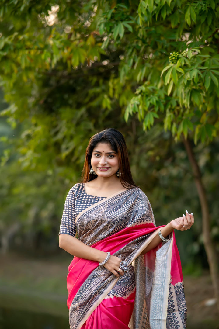 Lovely pink soft tussar silk saree with intricate Madhubani prints and charming tassels, perfect for bridal wear.