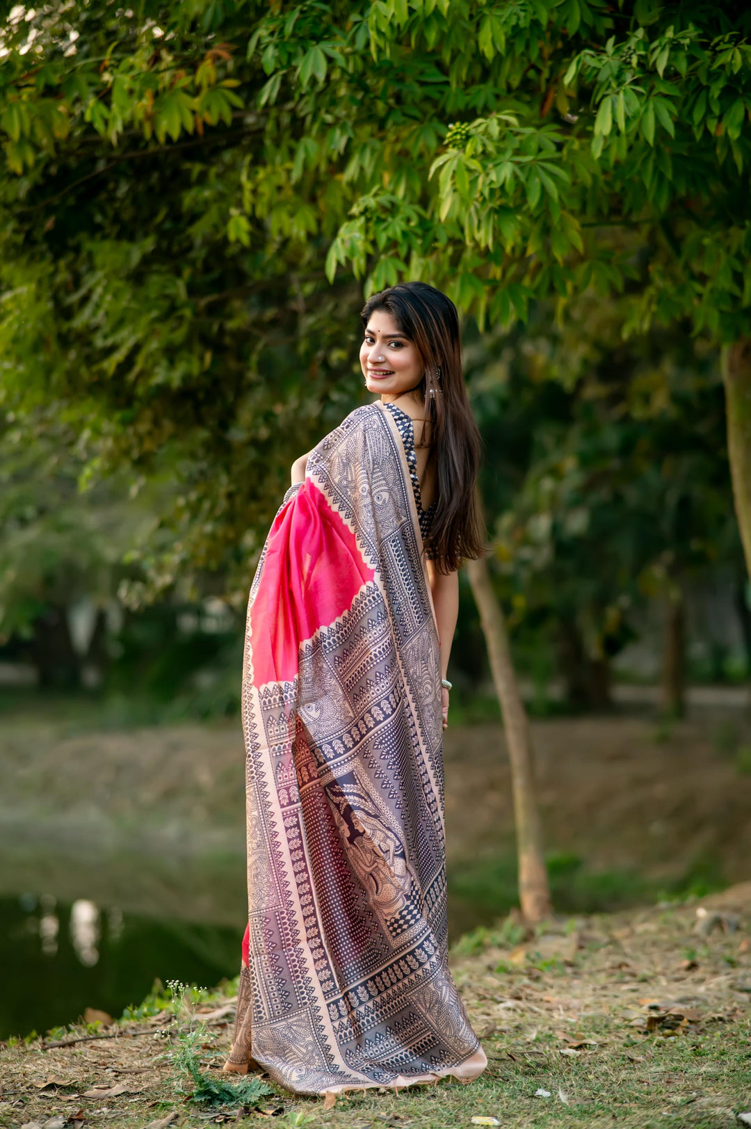 Beautiful pink soft tussar silk saree featuring vibrant Madhubani prints and elegant tassels, ideal for wedding functions.