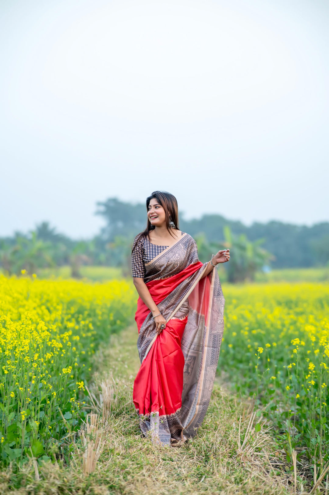 Exquisite pink soft tussar silk saree with detailed Madhubani prints and stylish tassels, perfect for traditional events.