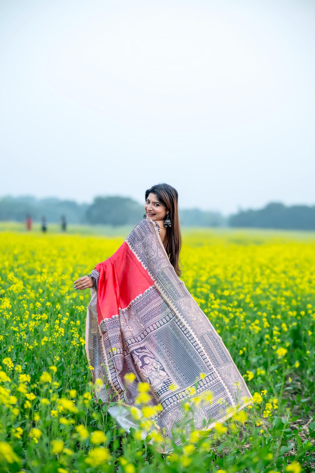 Timeless pink soft tussar silk saree with beautiful Madhubani prints and delicate tassels, ideal for evening functions.