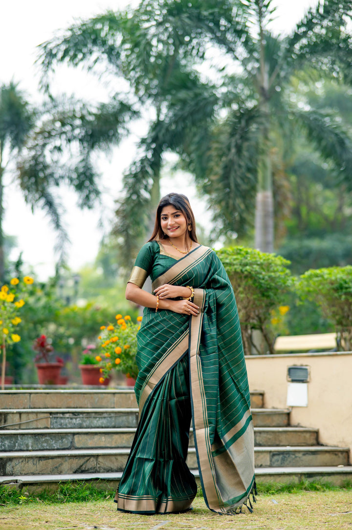 Gorgeous dark-green Banarasi saree with intricate zari pattern, ideal for festive occasions and weddings.