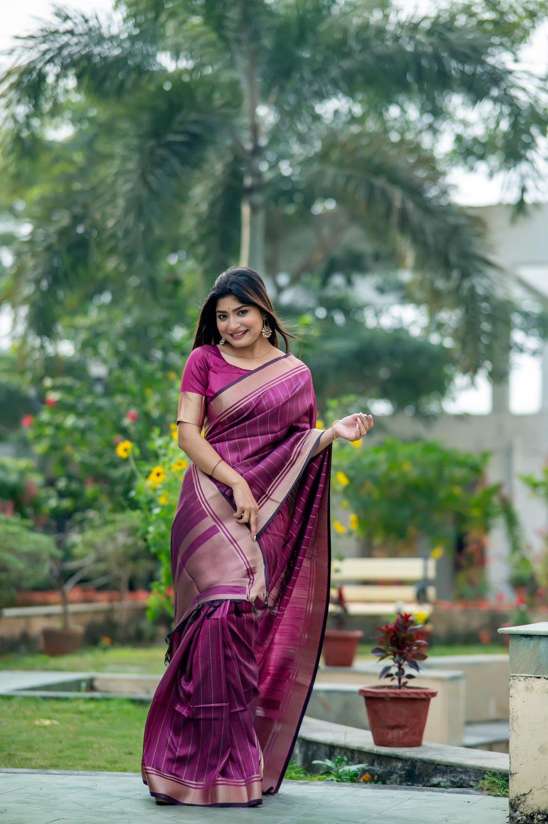 Stunning dark-purple Banarasi saree with rich zari weaving, ideal for festive occasions and special events.