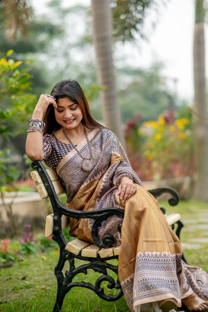 Stunning red soft tussar silk saree with intricate Madhubani prints and chic tassels, perfect for festive occasions.