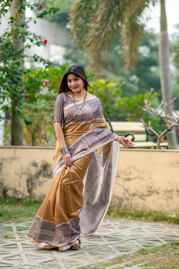 Gorgeous red soft tussar silk saree featuring Madhubani prints and stylish tassels, ideal for evening wear.