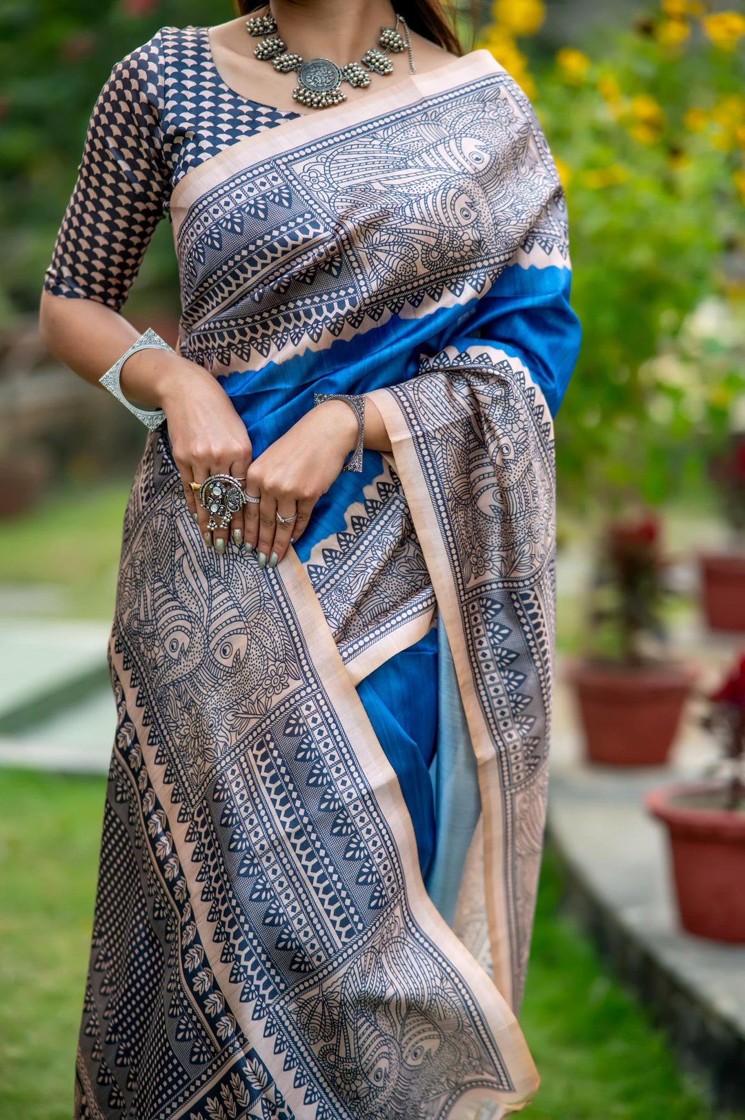 Elegant olive soft tussar silk saree with detailed Madhubani prints and chic tassels, ideal for festive occasions.