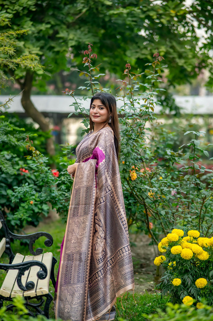 Timeless olive soft tussar silk saree featuring vibrant Madhubani prints and elegant tassels, perfect for traditional events.