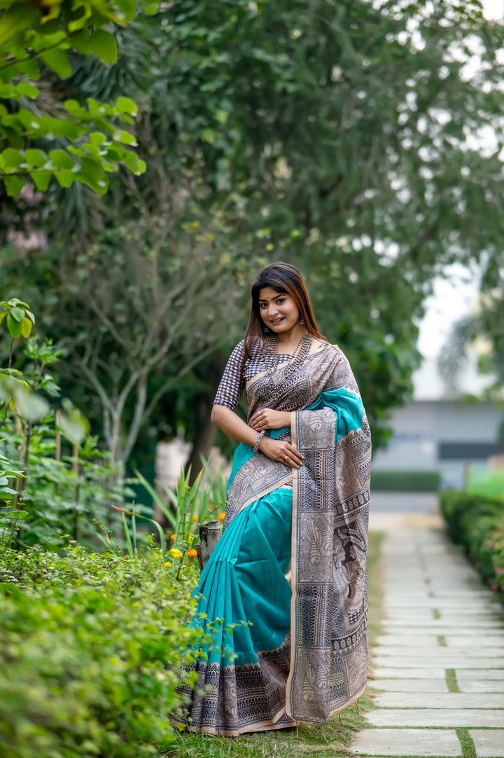 Gorgeous blue soft tussar silk saree with detailed Madhubani prints and stylish tassels, perfect for festivals.