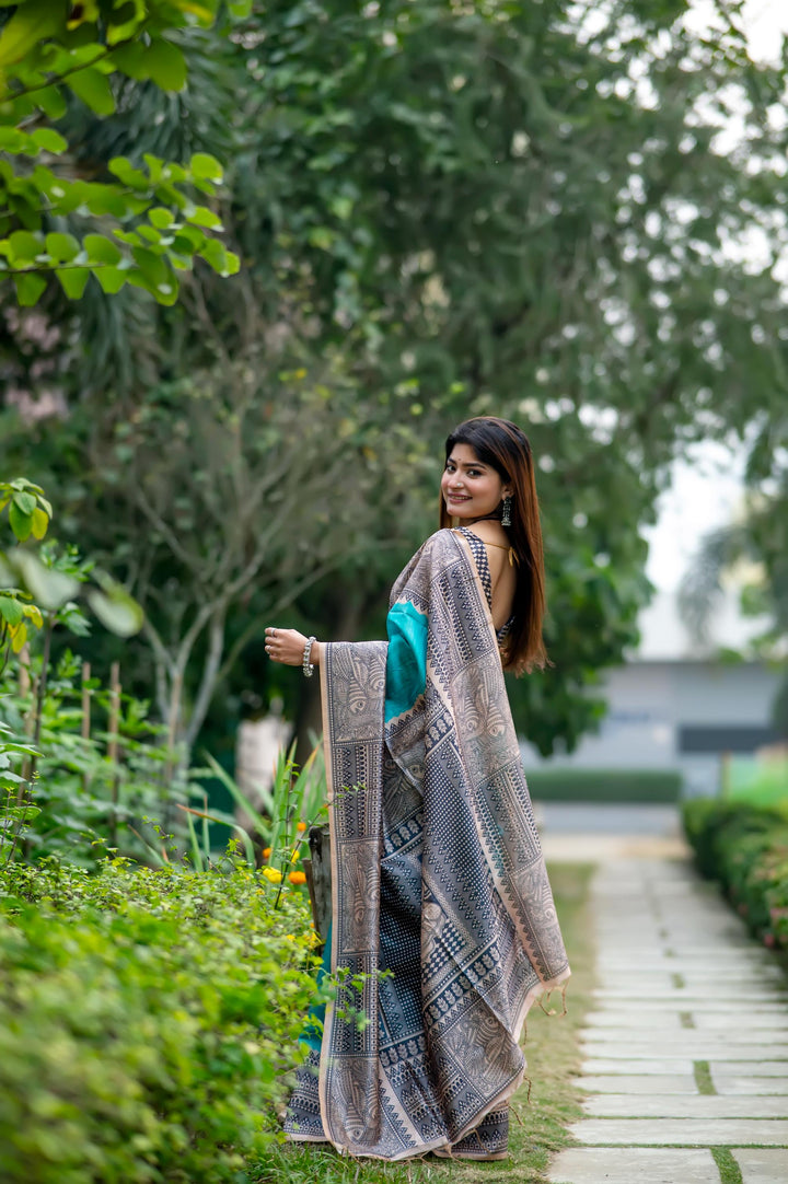 Timeless blue soft tussar silk saree featuring Madhubani prints and chic tassels, ideal for weddings and traditional events.