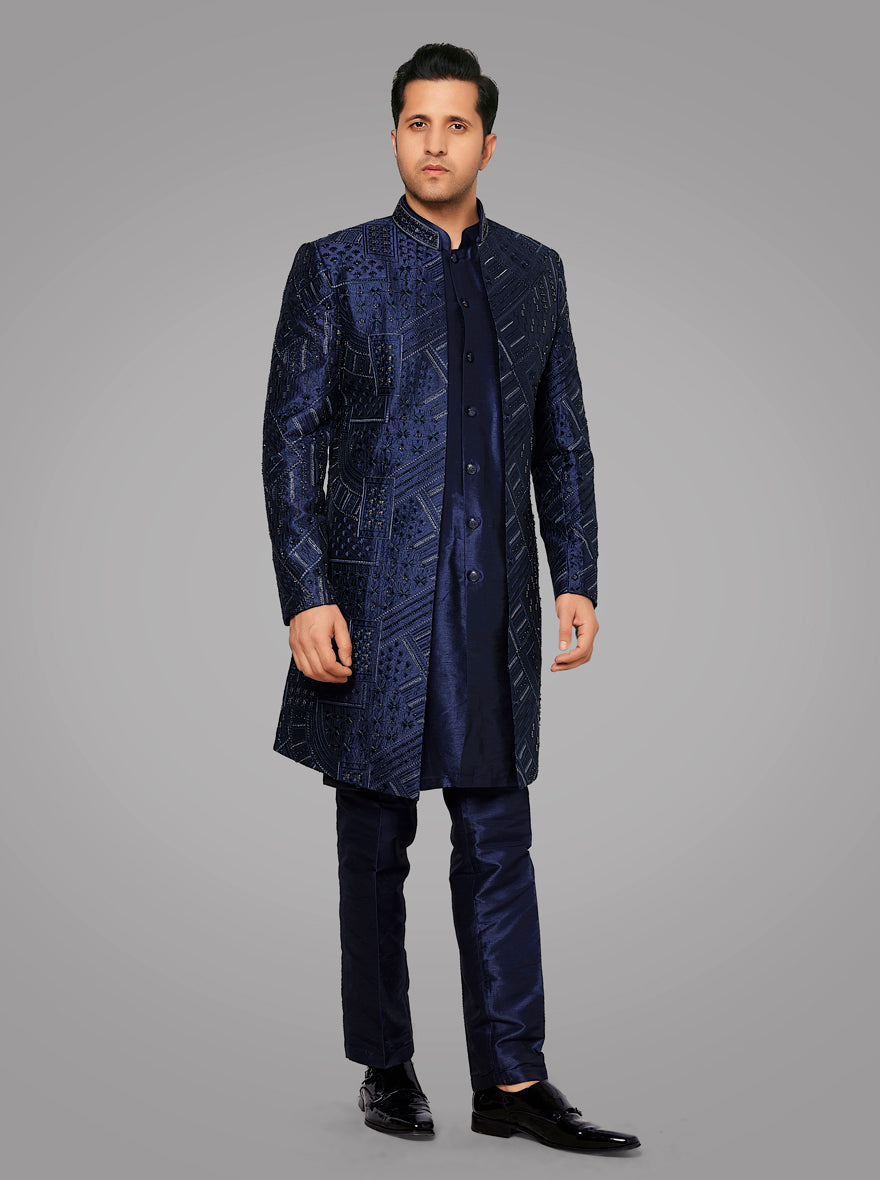 This navy blue sherwani features detailed embroidery and a clean straight fit, perfect for elegant occasions.