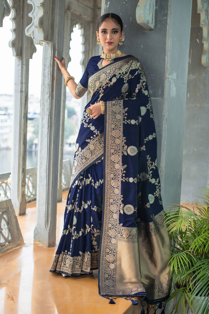 Luxury Banarasi Katan silk saree with silver and gold zari weaves and a decorative tassel border.