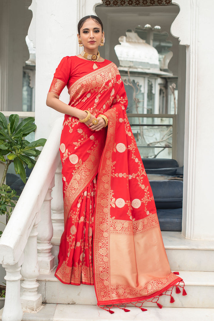 Luxury Soft Banarasi Katan silk saree with a beautiful weaving pallu and decorative tassels.