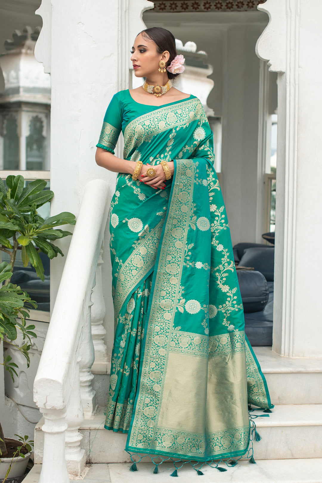 Celebrate with this Soft Banarasi Katan silk saree, featuring silver and gold zari weaves and tassel border.