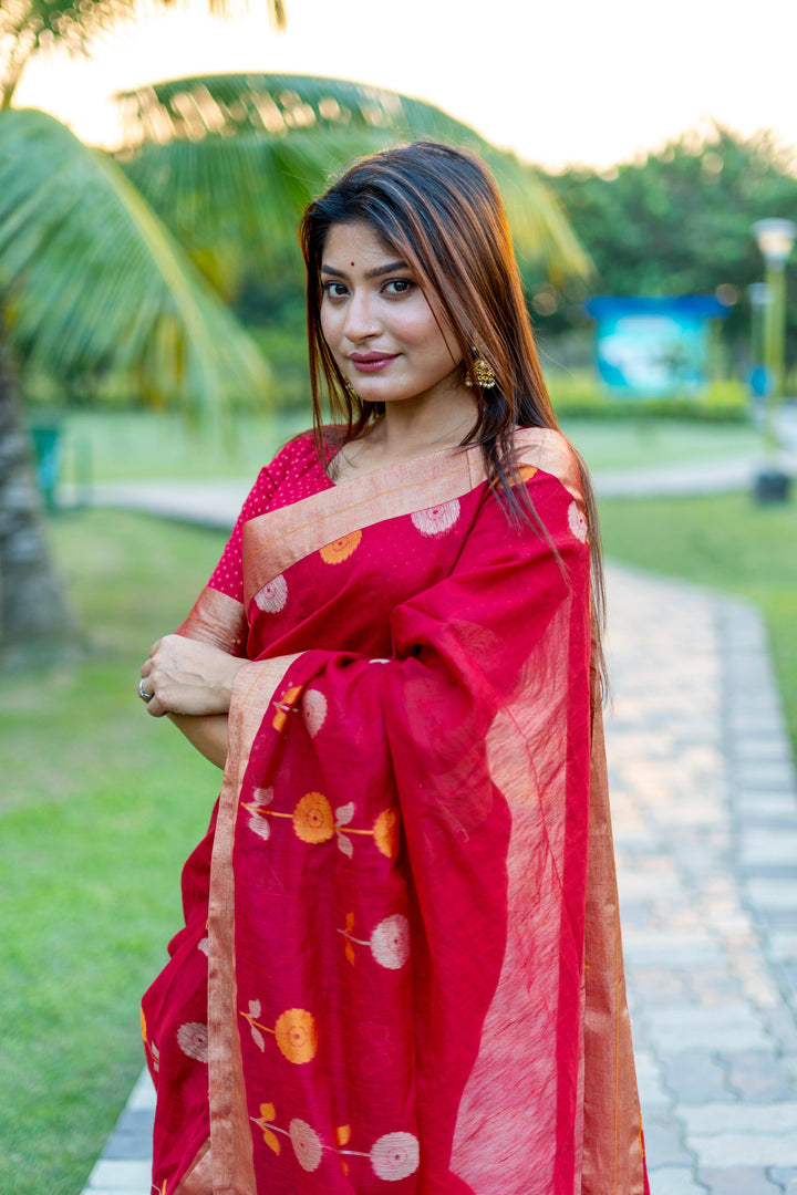 Bold red pure linen silk saree with a beautiful Jamdani border and luxurious brocade blouse, perfect for festivals.