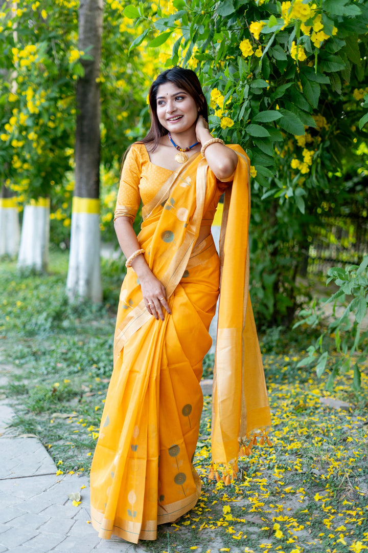 Vibrant yellow pure linen silk saree with Jamdani border and brocade blouse, perfect for cultural events.