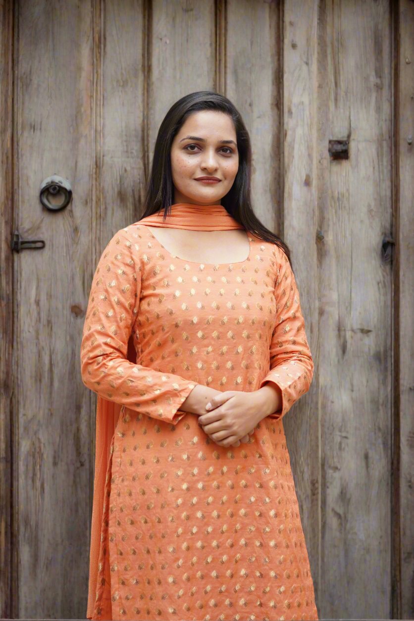 Chand Sa Chanderi suit in vibrant orange, showcasing elegance for festive wear.