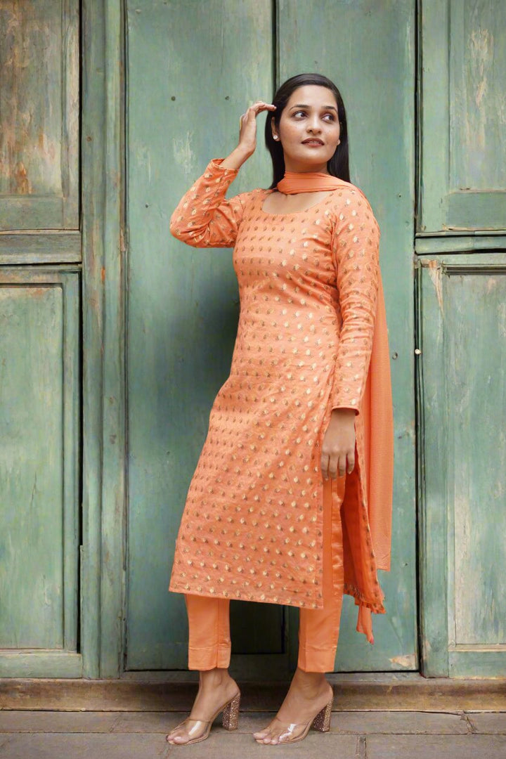 Chic orange Chanderi suit set, featuring exquisite detailing for a traditional look.