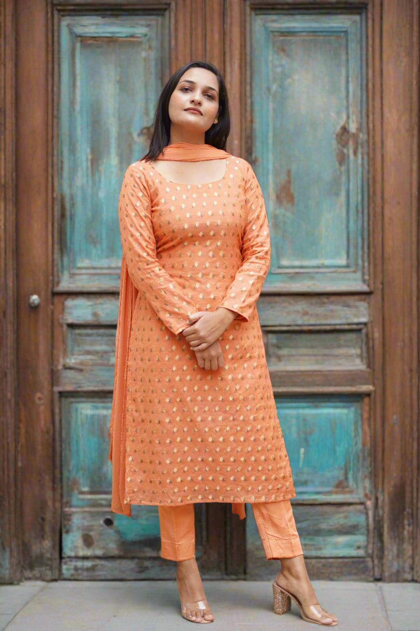 Vibrant orange Chanderi suit, embodying traditional charm for festive celebrations.