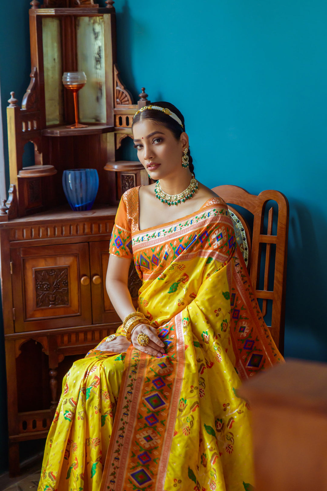 Designer Yellow saree with meena and zari weaving, featuring a vibrant Patola border, perfect for special occasions.