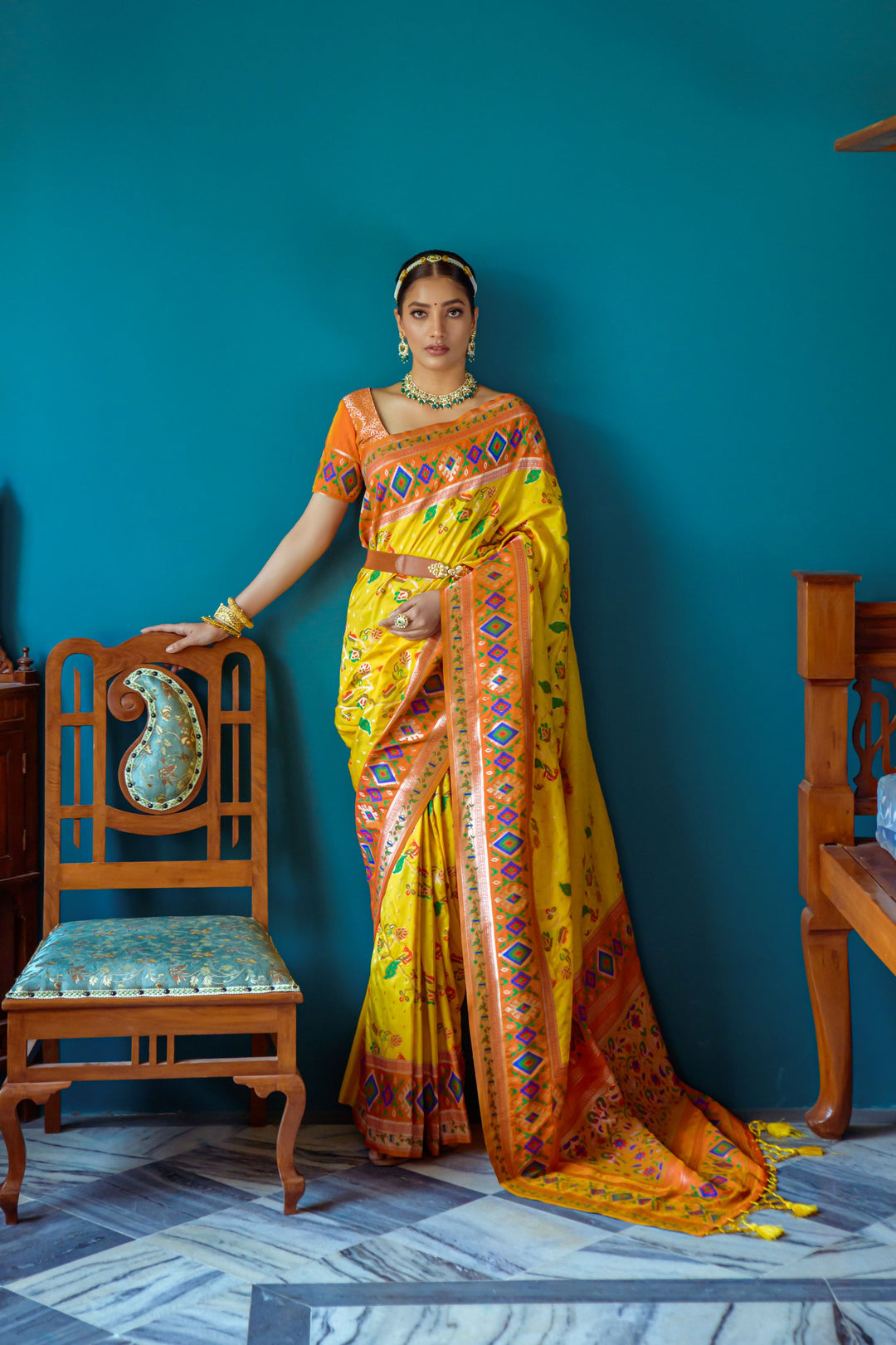 Stunning Yellow Banarasi Indian sari with zari weaving and colorful lace, perfect for a festive celebration.