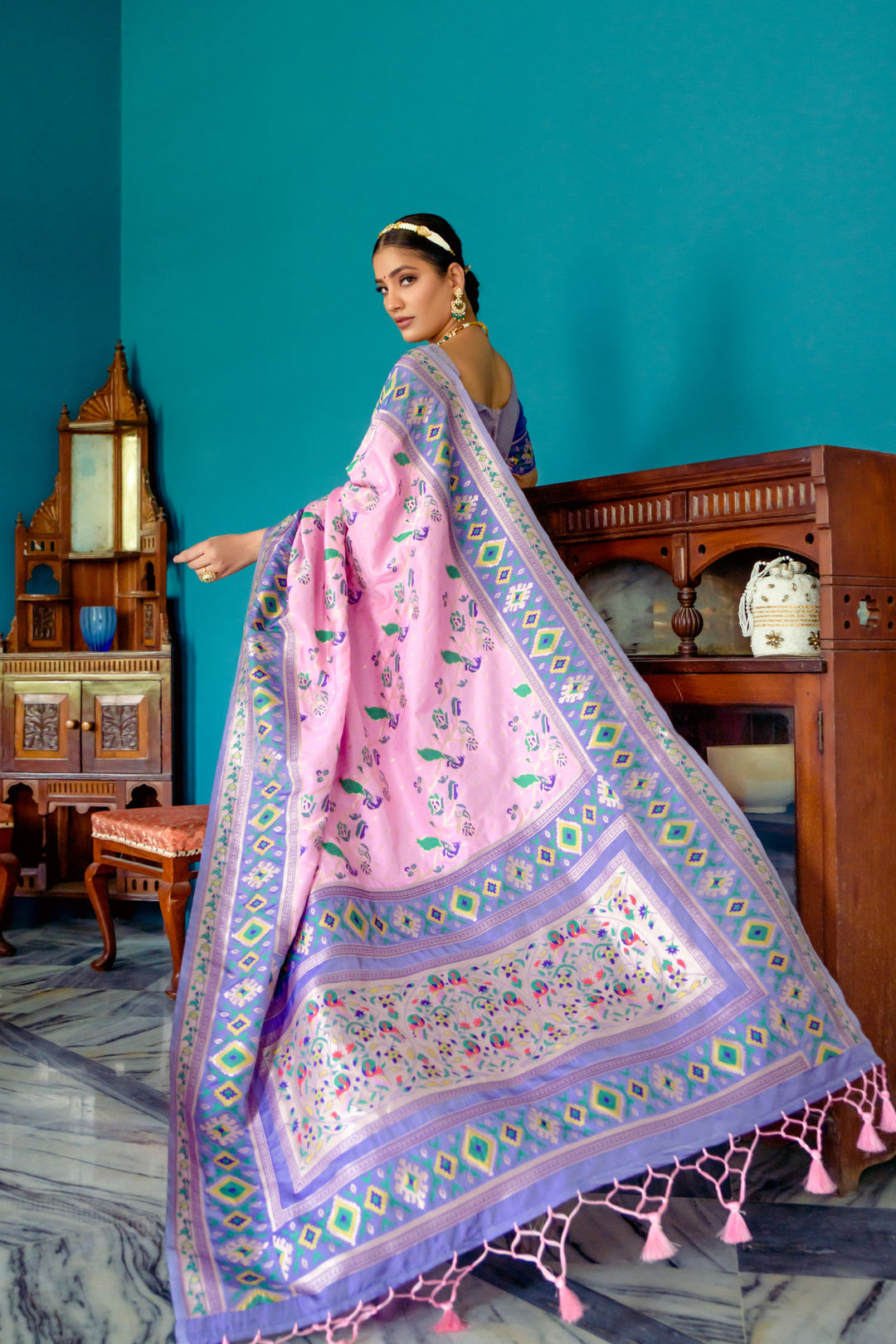 Timeless Pink Indian saree featuring exquisite zari work and Patola border, ideal for any special event.