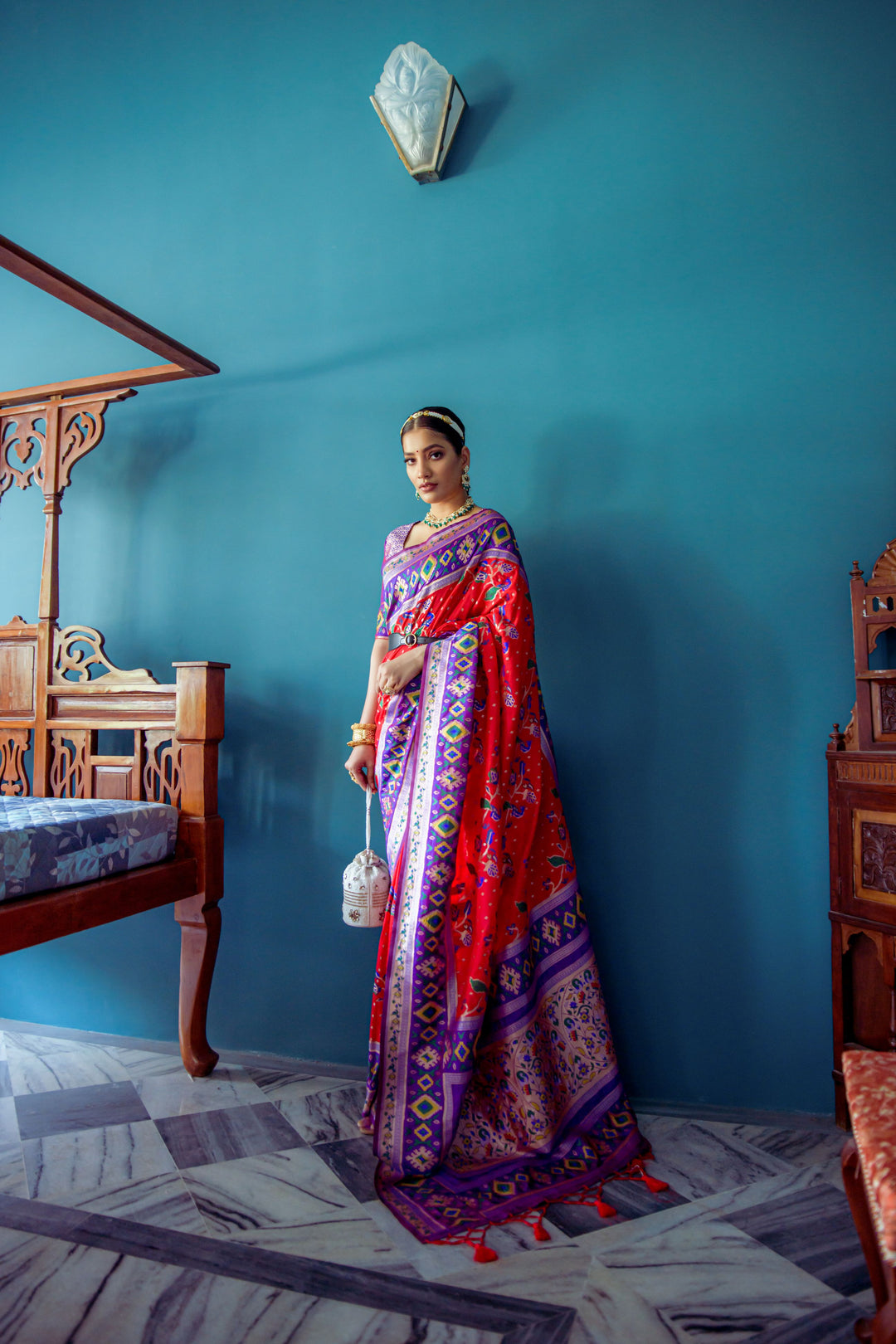 Beautiful Red designer saree with Patola border, crafted for festive occasions and elegant affairs.