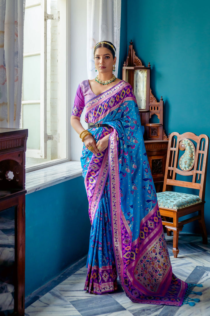 Blue Indian saree featuring a vibrant Patola border and zari details, ideal for ethnic fashion lovers.