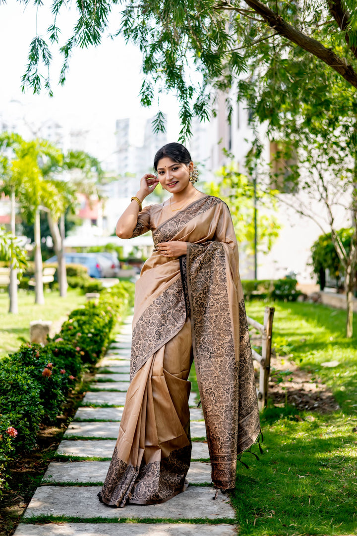 Elegant rosewood handloom raw silk saree featuring intricate weaving pallu and blouse piece, ideal for cultural events.