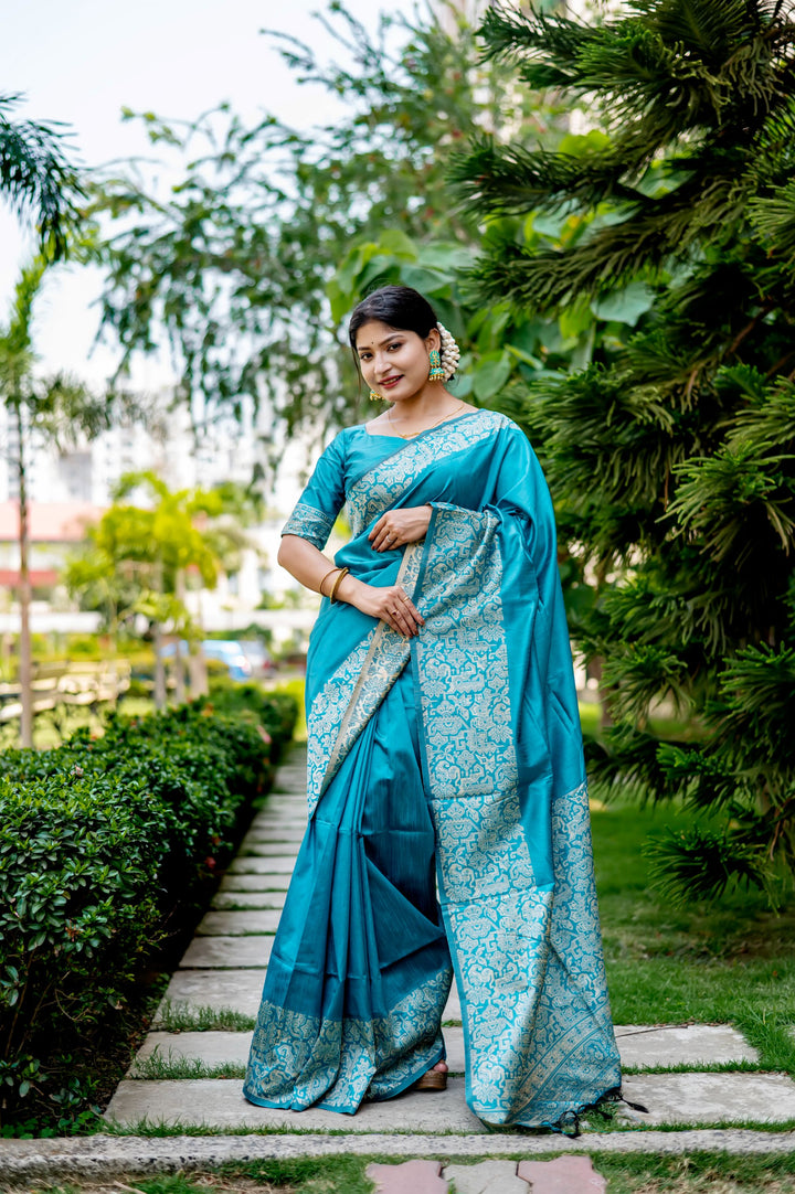 Bright yellow handloom raw silk saree with rich weaving pallu and matching blouse piece, perfect for celebratory occasions.