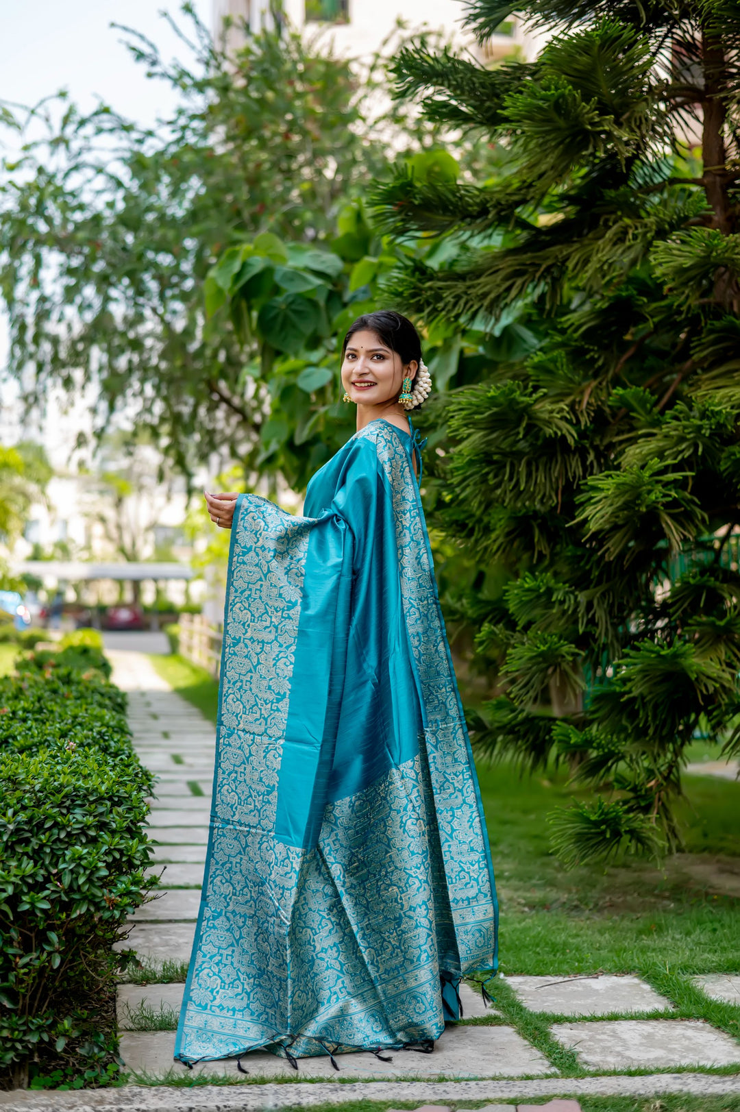 Elegant yellow handloom raw silk saree with intricate weaving pallu and blouse piece, ideal for festive events.