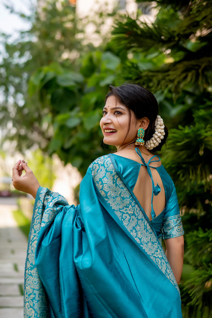 Beautiful yellow handloom raw silk saree with detailed weaving pallu and blouse piece, perfect for cultural gatherings.