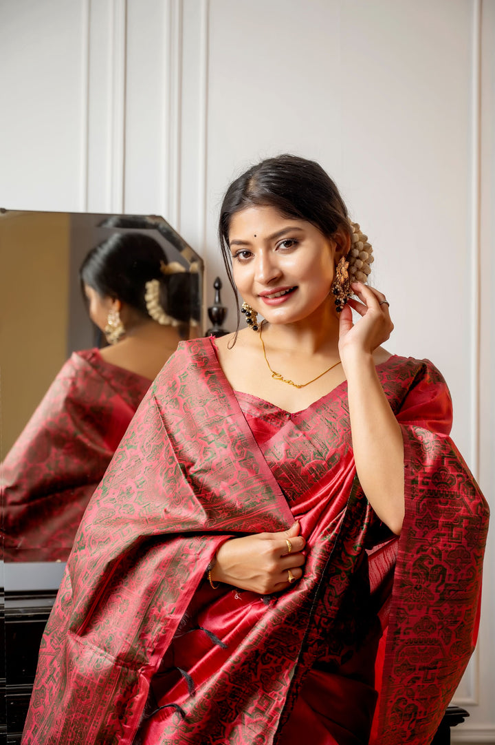 Gorgeous bright-pink handloom raw silk saree with rich weaving pallu and matching blouse piece, perfect for festive events.