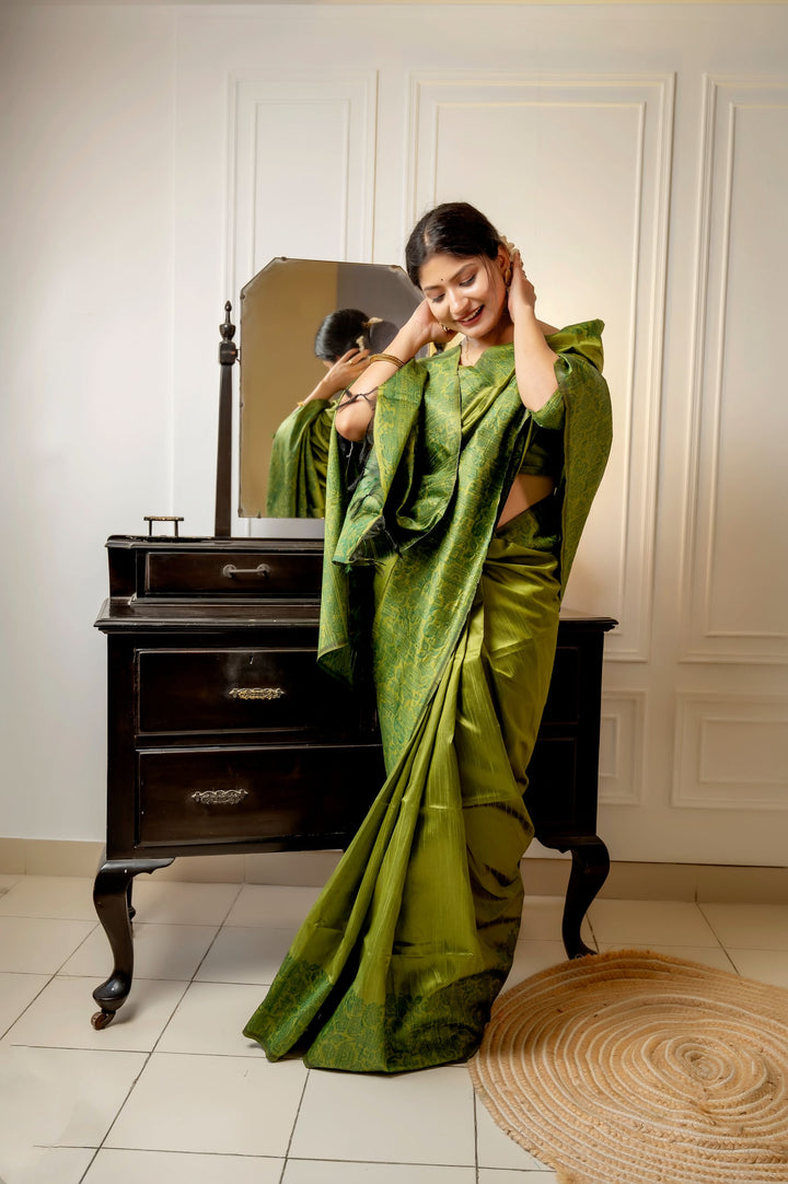 Elegant dark-purple handloom raw silk saree with detailed weaving pallu and blouse piece, ideal for special events.