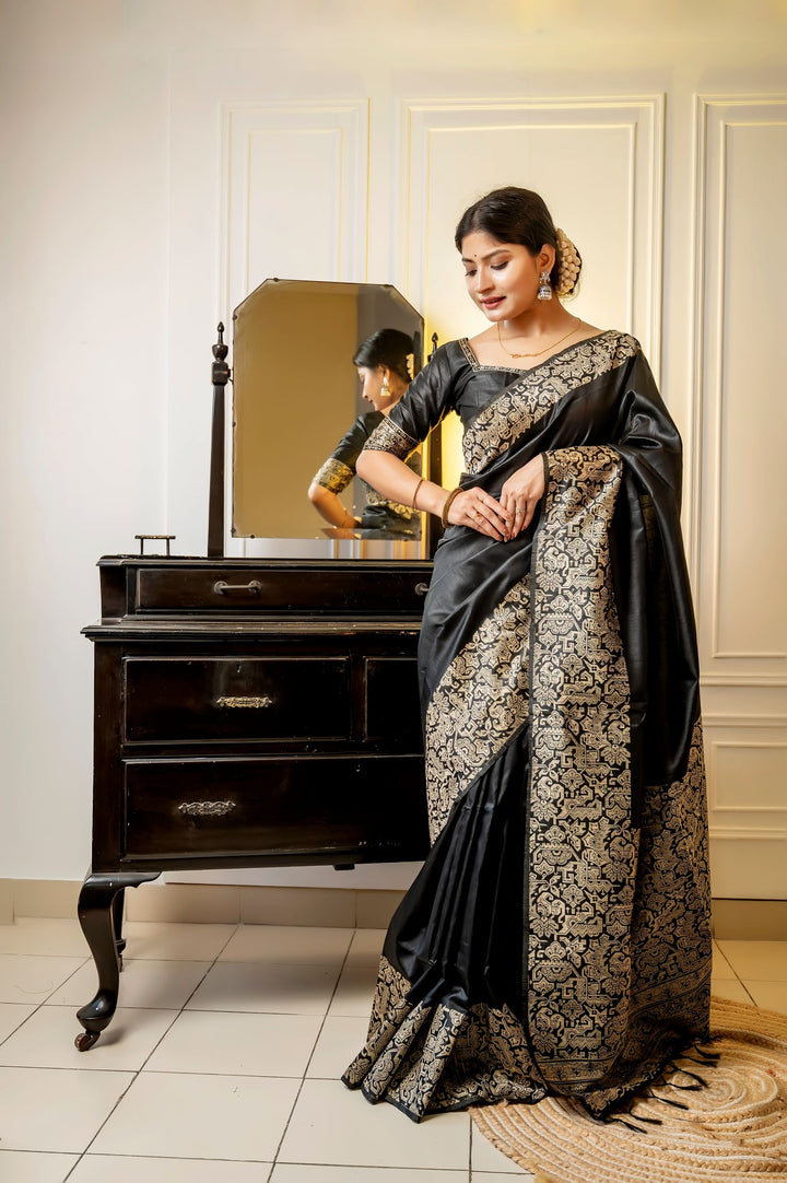 Beautiful dark-purple handloom raw silk saree with rich weaving pallu and matching blouse piece, perfect for festive occasions.