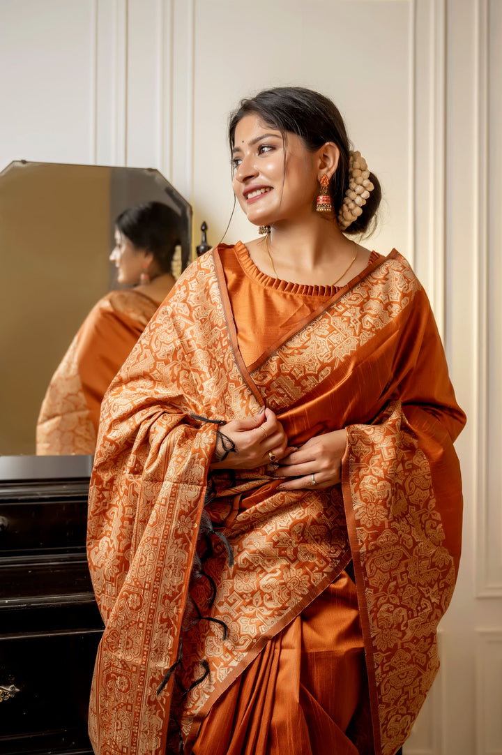 Gorgeous red handloom raw silk saree with rich weaving pallu and matching blouse piece, ideal for festive celebrations.