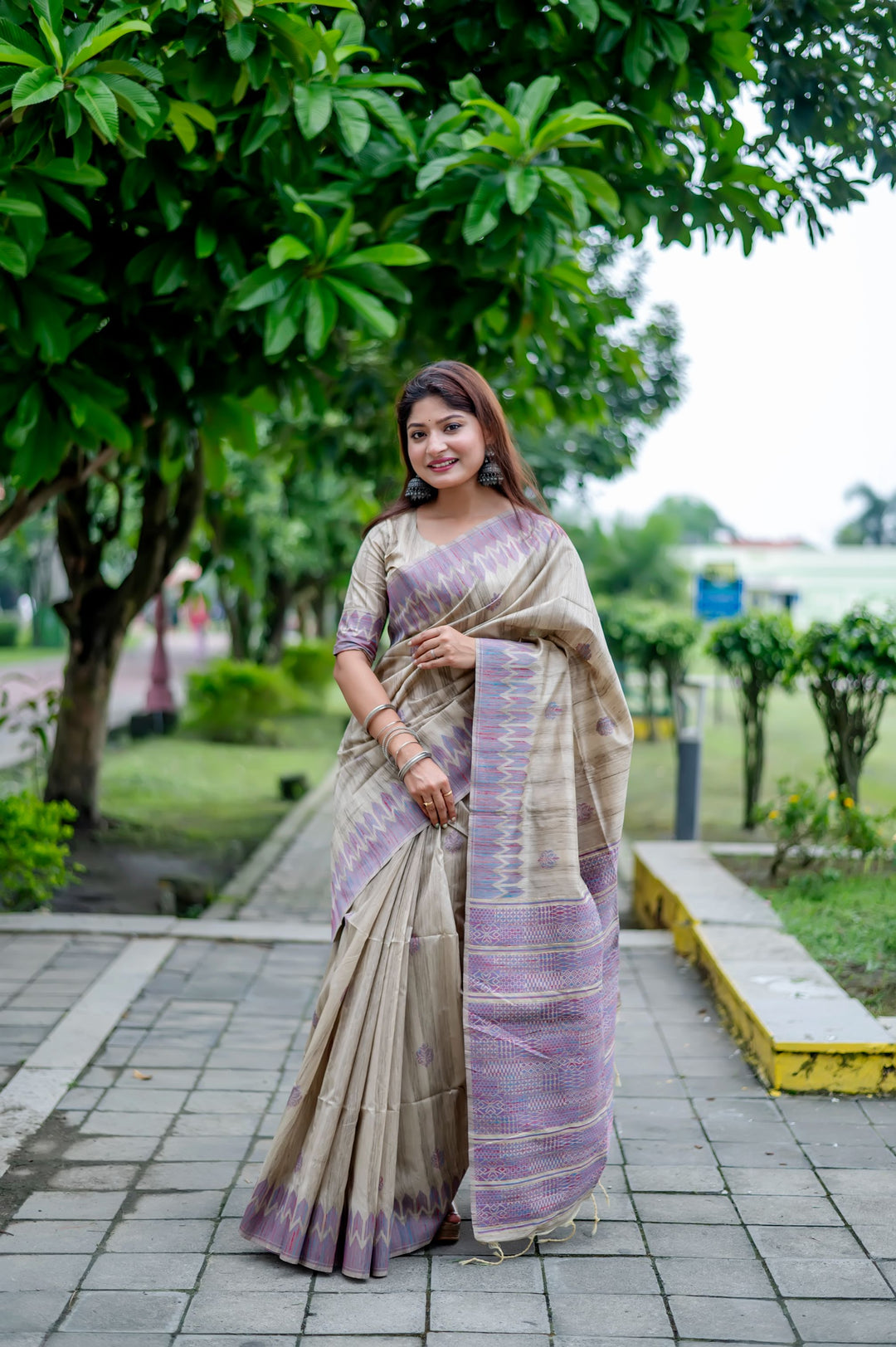 Elegant purple Tussar silk saree with all-over weaving and an exclusive pallu design, perfect for festive occasions.