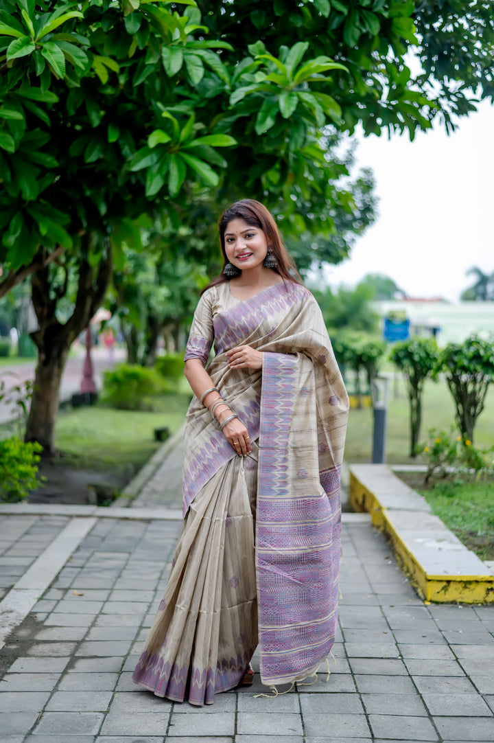 Elegant purple Tussar silk saree with all-over weaving and an exclusive pallu design, perfect for festive occasions.