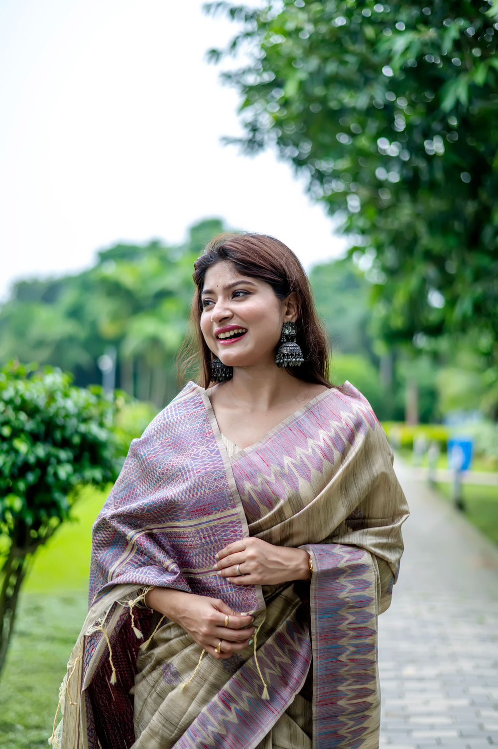 Royal purple Tussar silk saree featuring delicate all-over weaving and a designer pallu, perfect for cultural events.