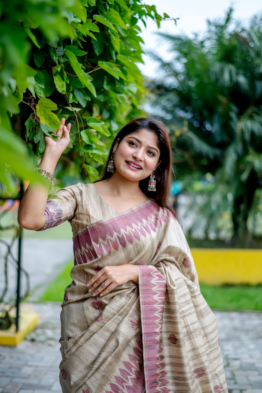 Stunning pink Tussar silk saree with all-over weaving and exclusive pallu details, perfect for festivals.