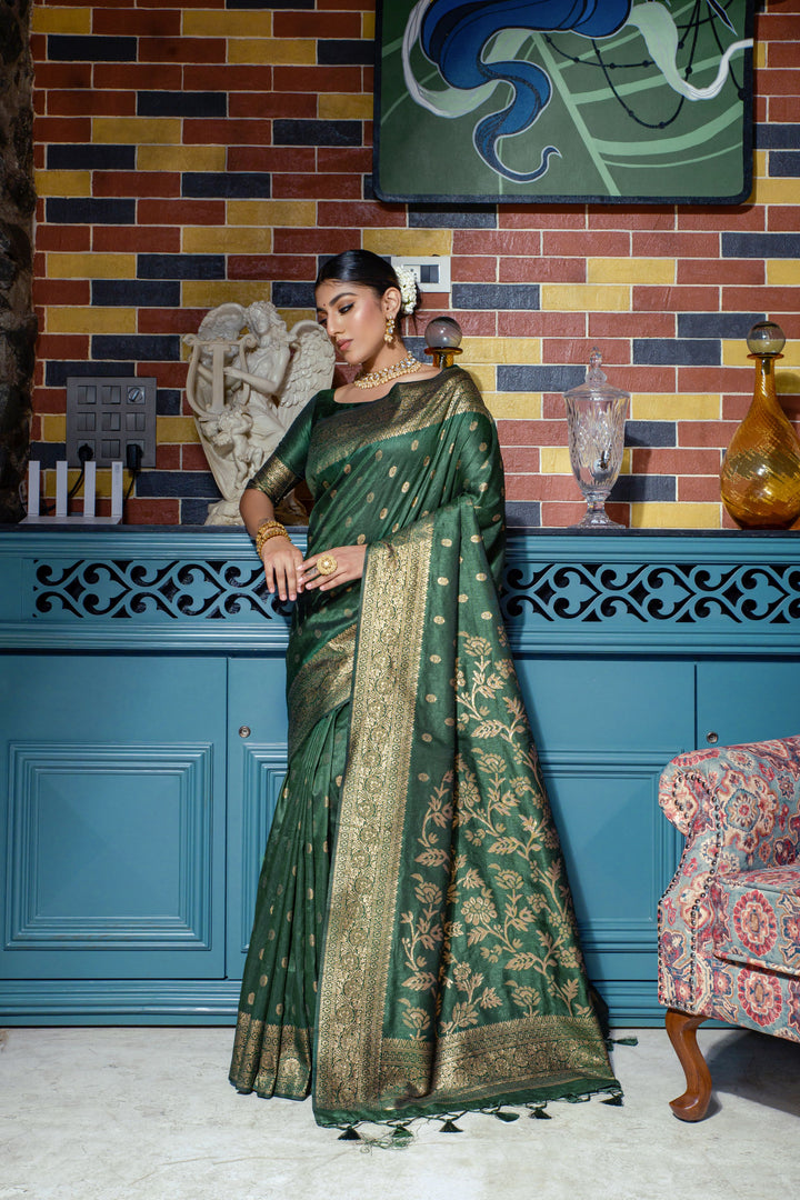 Gorgeous Dark green Indian saree with a rich zari border and fancy tassels, perfect for weddings and special cultural events.