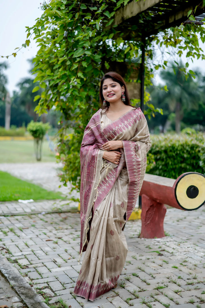 Soft pink Tussar silk saree with intricate weaving and an exquisite pallu, perfect for intimate gatherings.