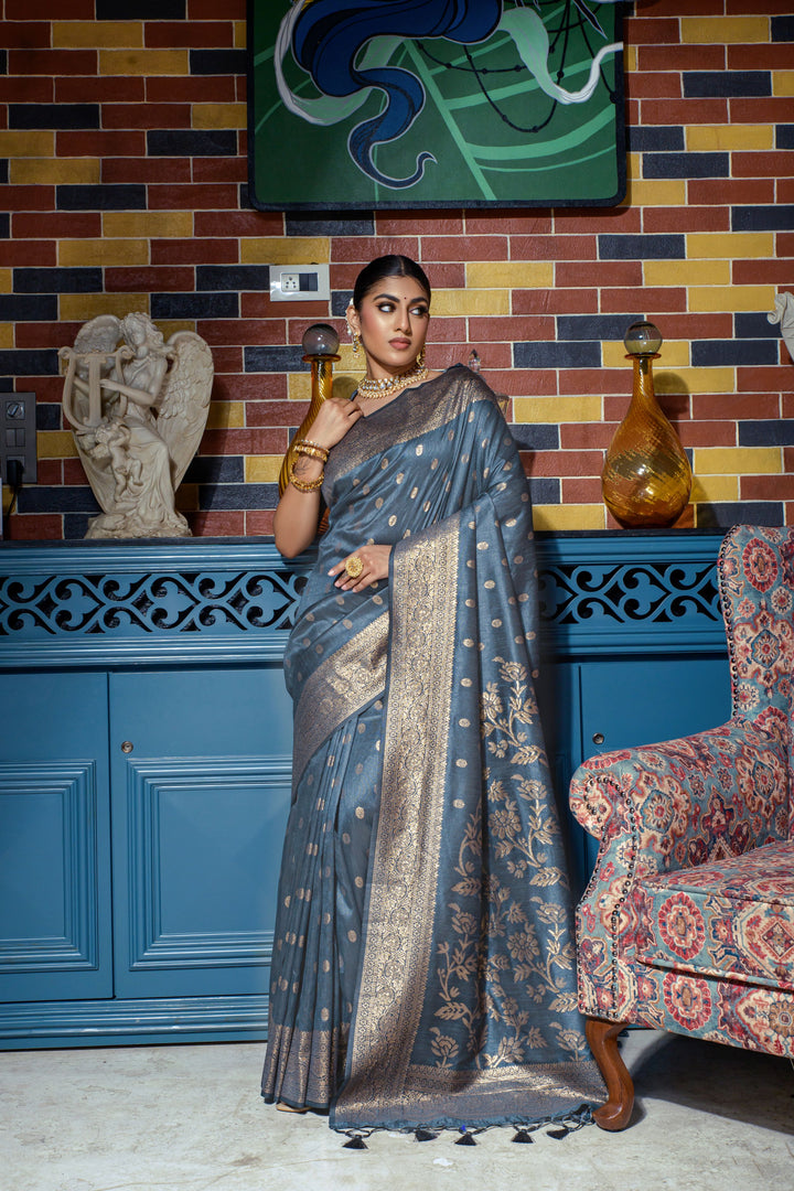 This Blue saree with intricate zari weaving, luxury tassels, and a running blouse piece makes for the perfect wedding attire.