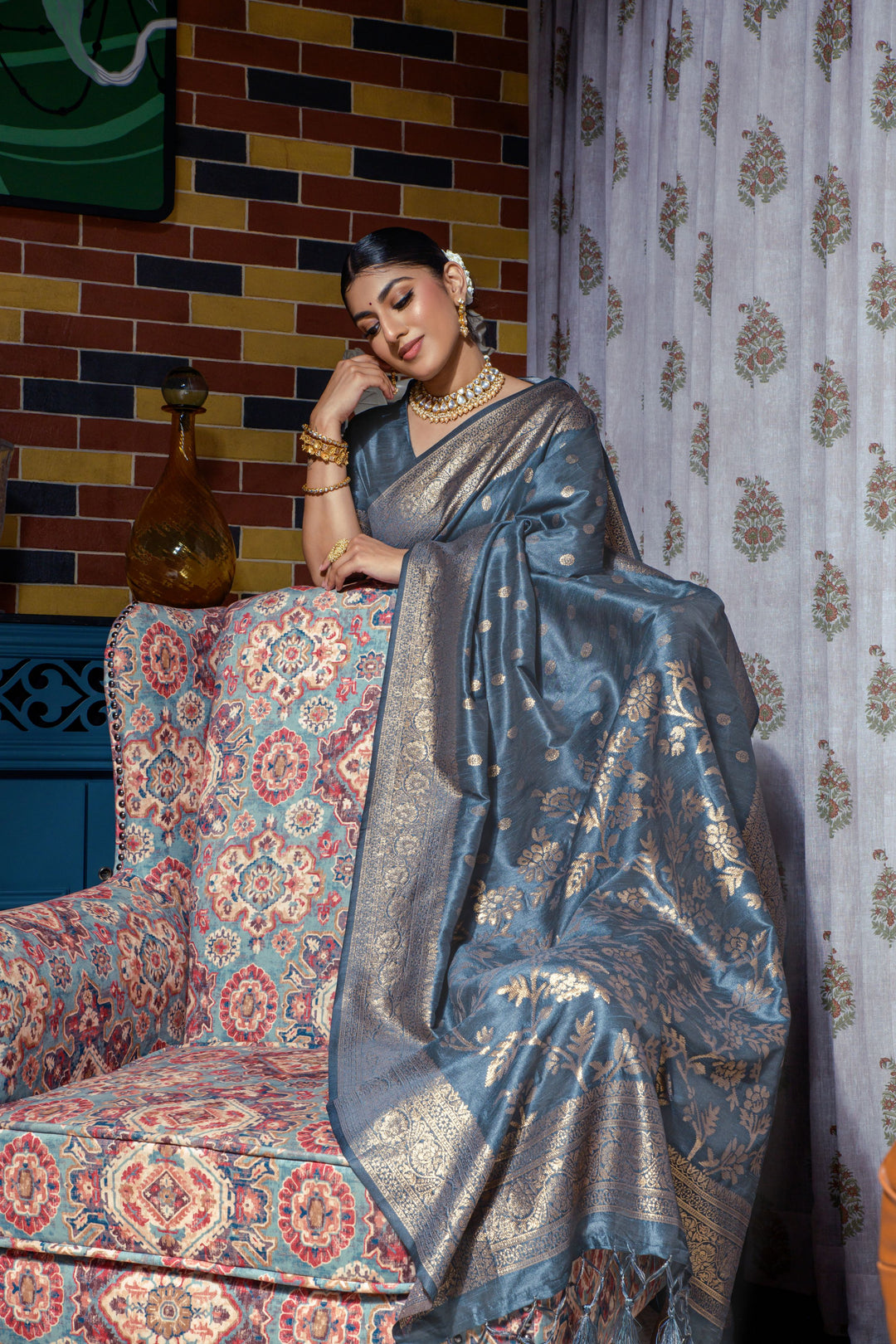 A beautiful Blue Indian wedding saree featuring intricate zari work and tassels, perfect for cultural attire on special occasions.