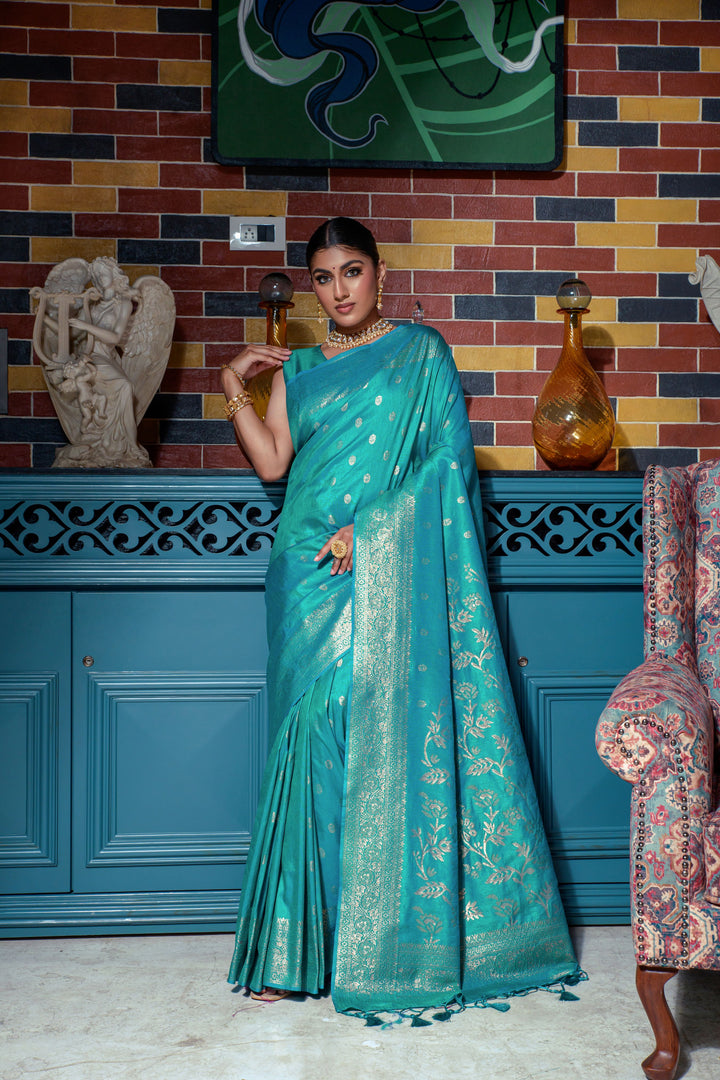 Traditional Sea blue Indian sari crafted from premium Banarasi raw silk, featuring a luxurious zari border and fancy tassels.