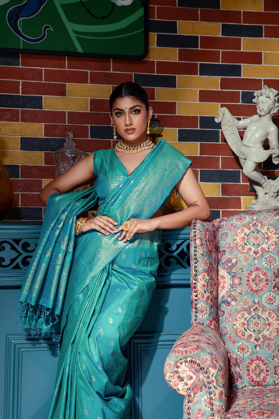 Luxurious Sea blue Indian saree with intricate zari work and fancy tassels, perfect for celebrations and cultural events.