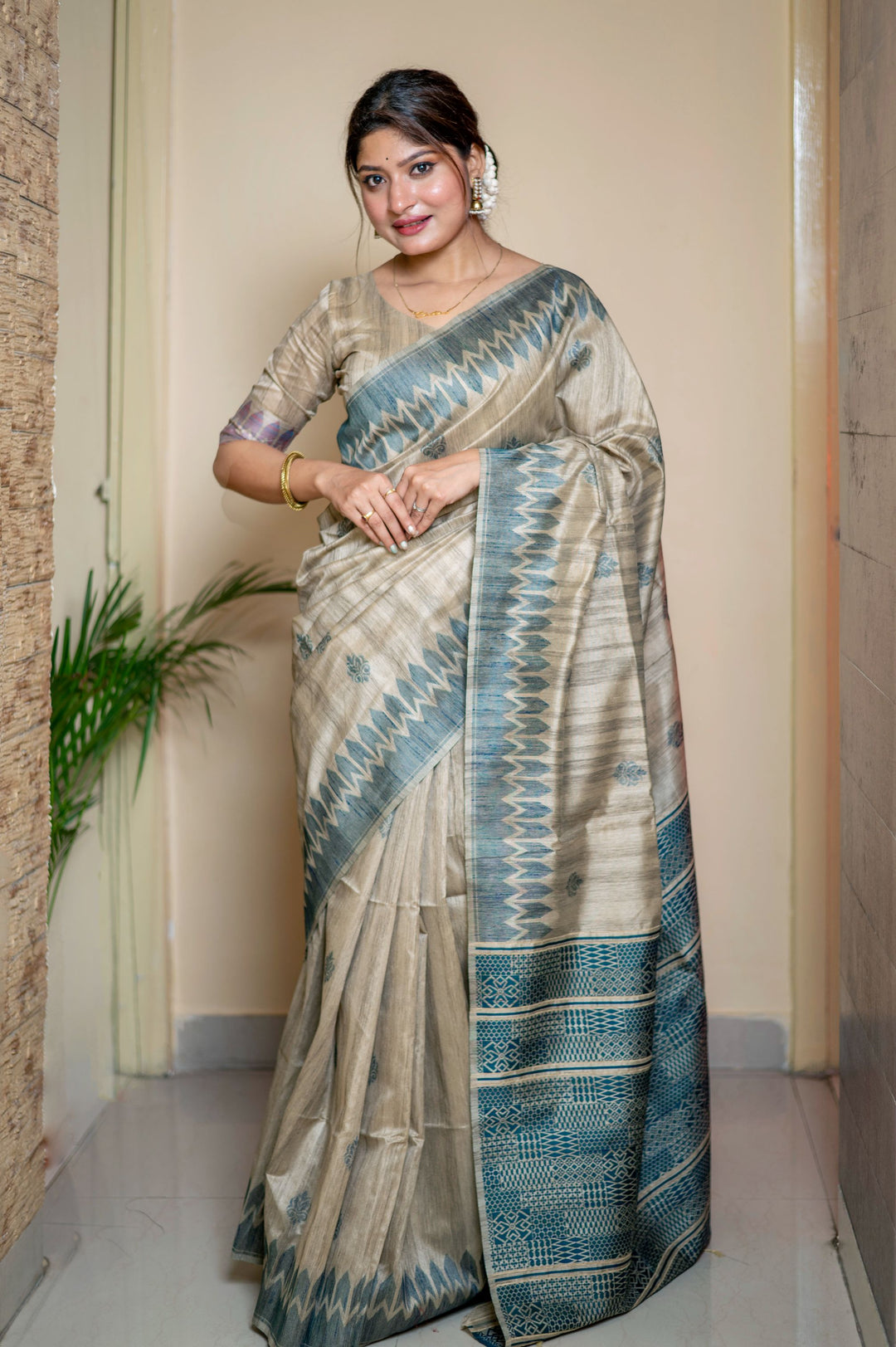 Timeless blue Tussar silk saree with rich weaving and an exclusive pallu, perfect for upscale events.