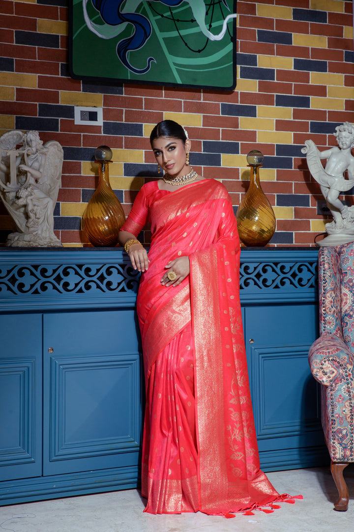 Show your style in this Red Indian saadi with intricate zari work and a running blouse piece, perfect for festive occasions.