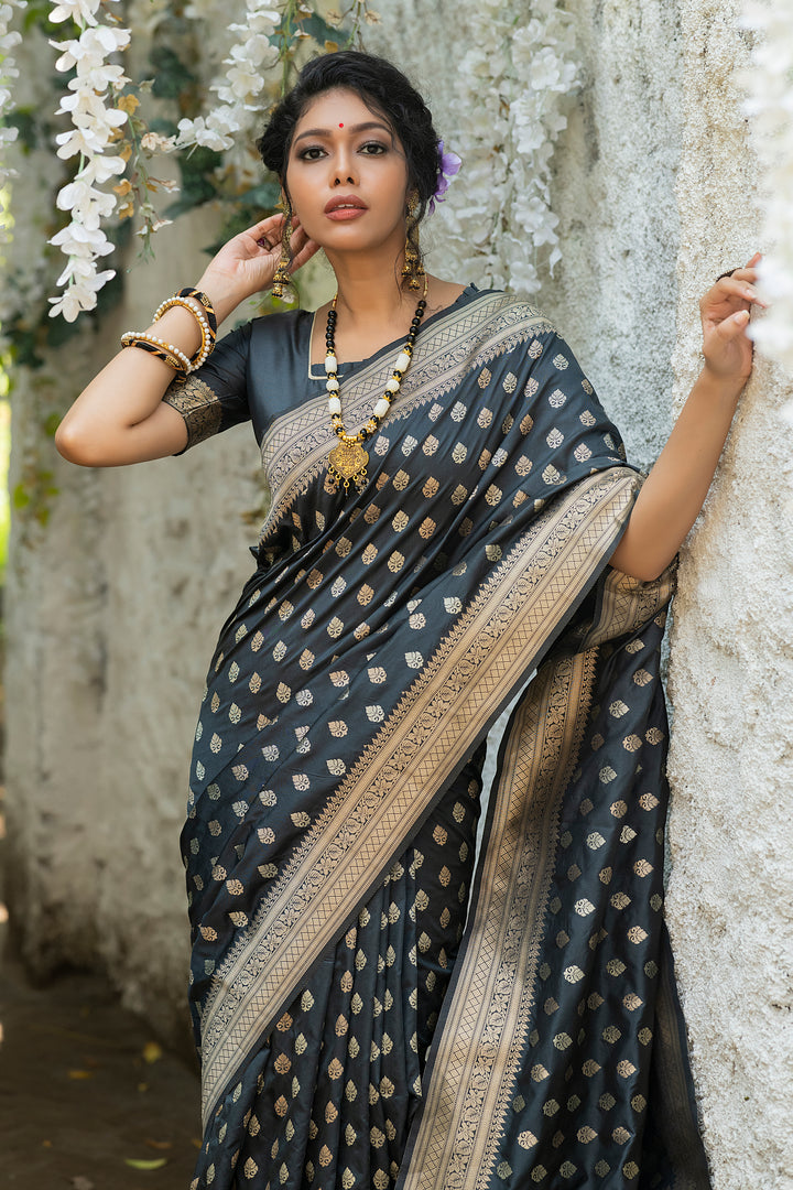 Soft Banarasi Katan silk saree with intricate zari border and tassels for festive events