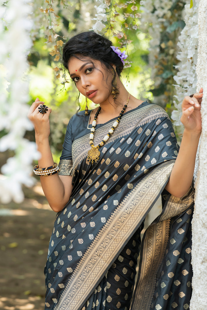 Soft Banarasi Katan silk saree with intricate zari weaves and a tassel border for celebrations